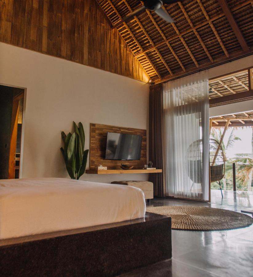 Neano Escape Hotel Manggis  Exterior photo A bedroom at the resort